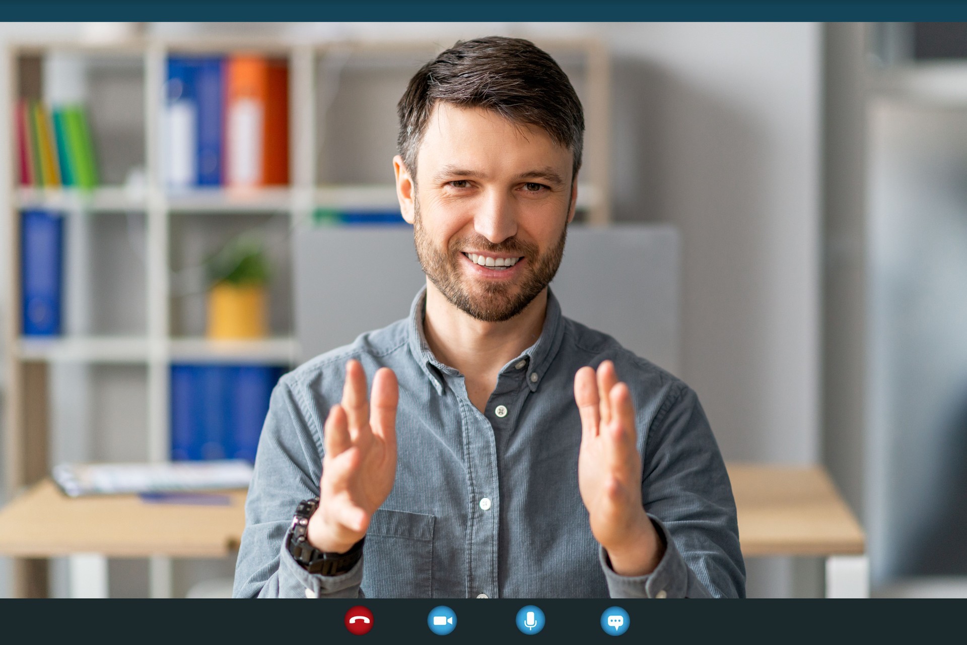 Online interview concept. Device screenshot with mature man making video call, talking at camera, webcam view